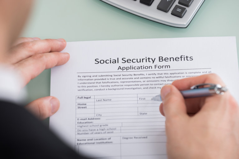 Man filling out a social security disability form