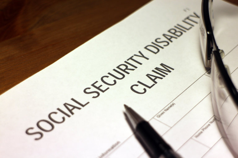 Someone filling out a social security disability claim.