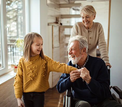 Grandpa in wheelchair with happy grandchild