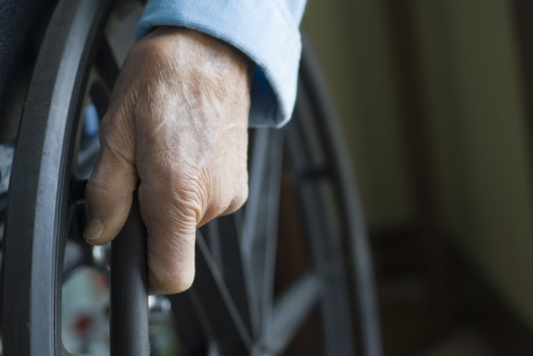 elderly, disabled individual in wheelchair
