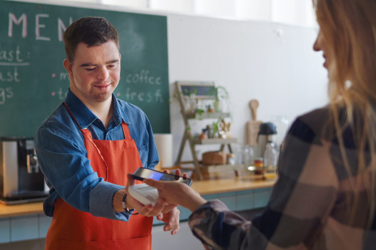 disabled young man with down syndrome working