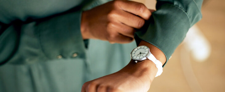 woman looking at watch for time