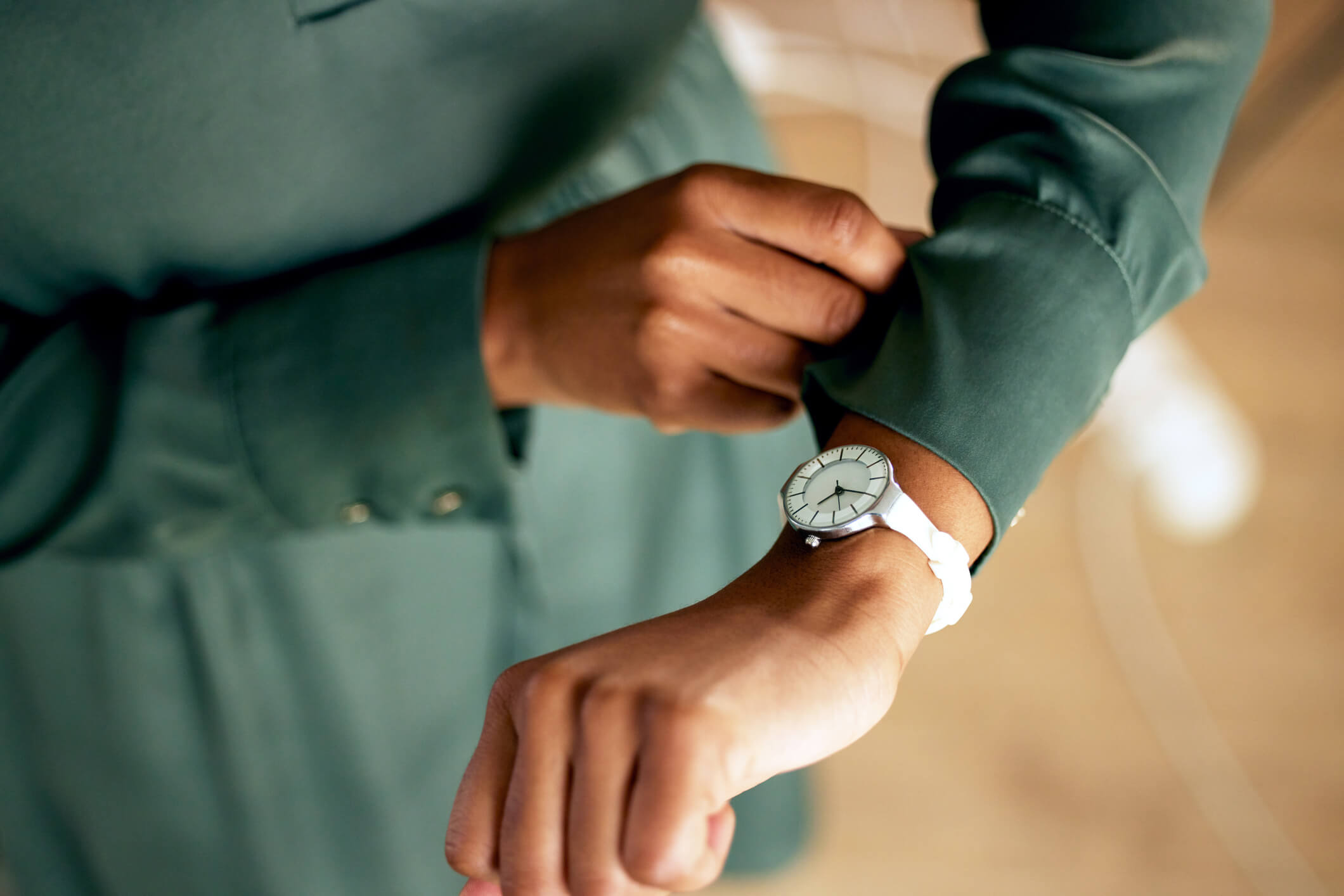 woman looking at watch for time