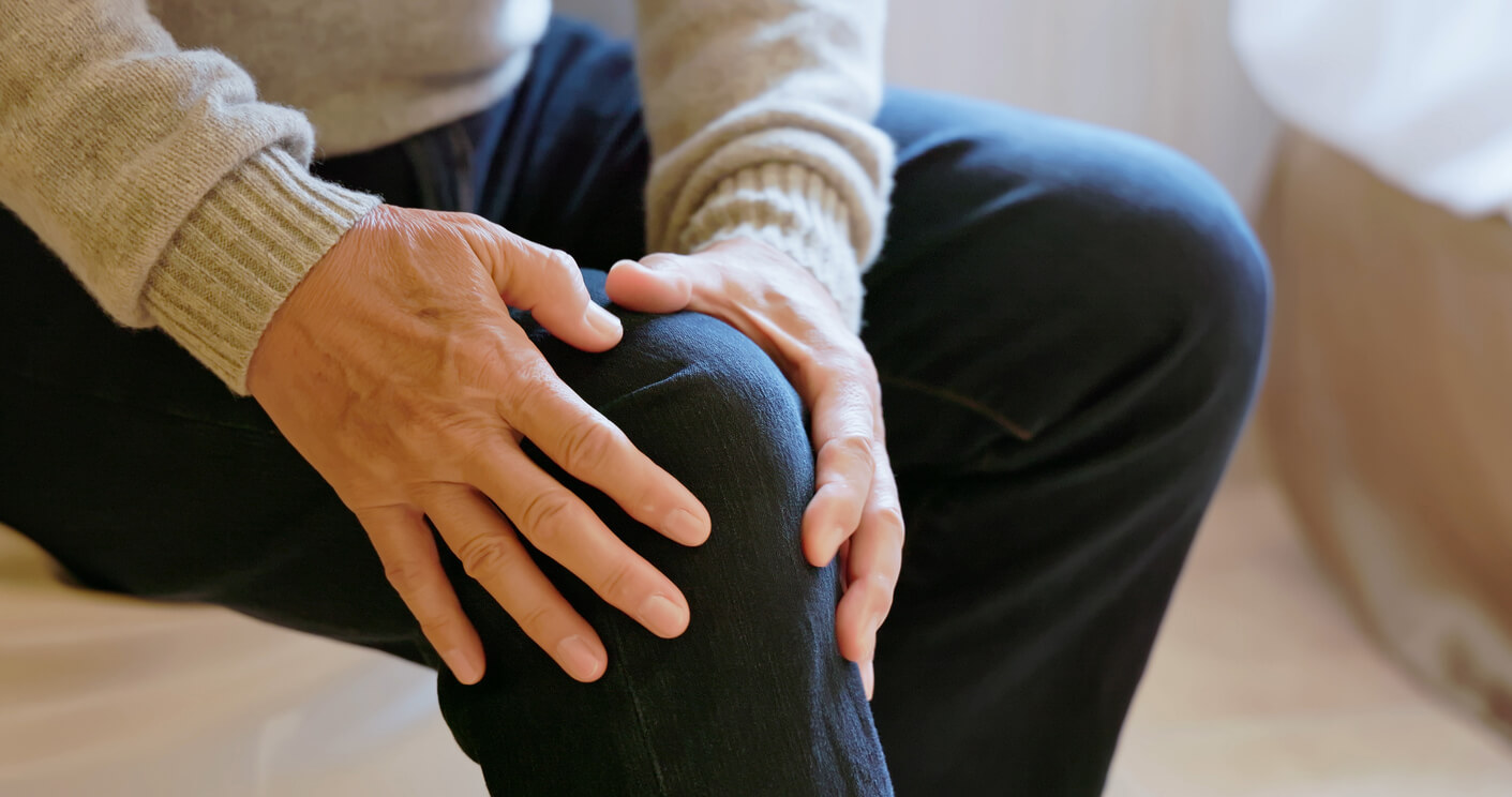 Closeup asian elderly male suffer from knee pain